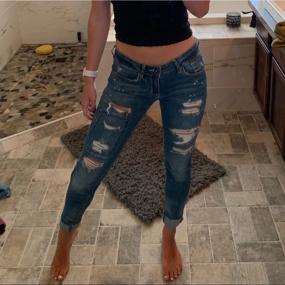 Paint spattered ripped jeans
